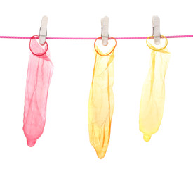 bright condoms hanging on clothes line