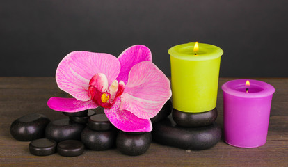 Obraz na płótnie Canvas Spa stones with orchid flower and candles