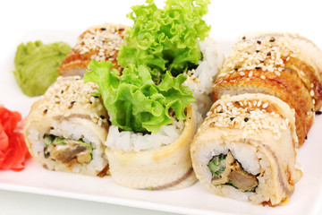 Tasty rolls served on white plate close-up