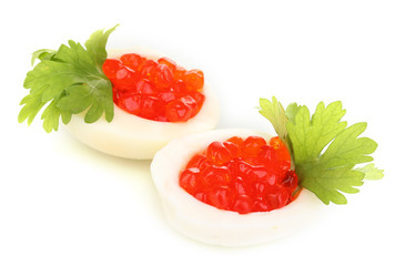 Red caviar in eggs isolated on white