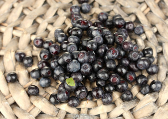 Fresh blueberries on wicker mat close-up