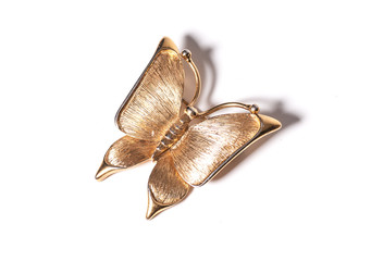 Gold butterfly pendant on white