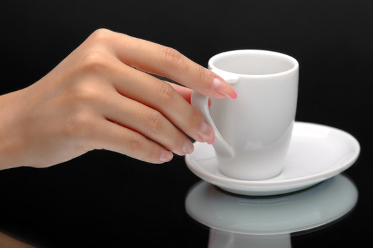 Hand holding a coffee cup