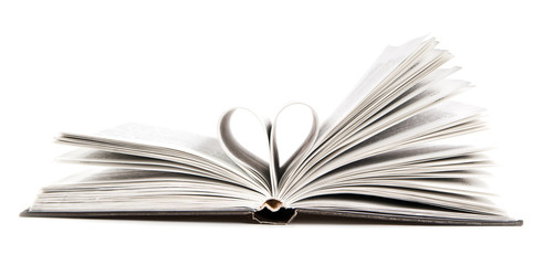 pages of a book curved into a heart shape