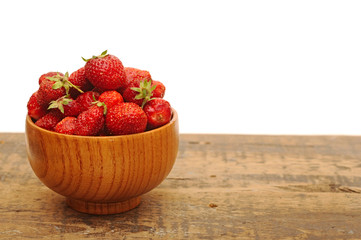 Red strawberries on old wood table
