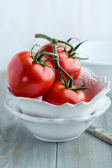 Tomatoes on the vine in a bowl