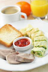 Breakfast with omelet and veal tongue