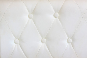 luxury white  leather with a botton use as background texture
