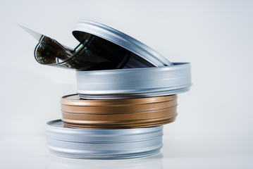 Three film tins with film reel