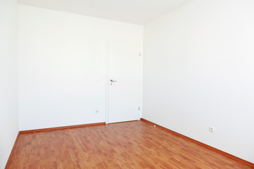 Empty room with white door
