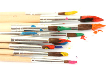 Obraz premium Paint brushes with gouache isolated on white