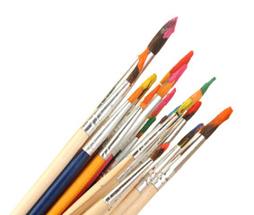 Fototapeta premium Paint brushes with gouache isolated on white