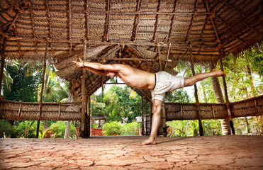 Yoga warrior in Indian shala