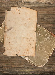 Weathered old papers on a wooden background