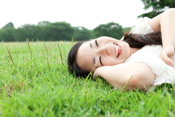 Beautiful young woman on the green