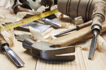 carpenter tools in pine wood table