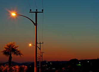 Electric power lines against a dawn sky