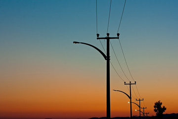 Electric power lines against a dawn sky - 42966018