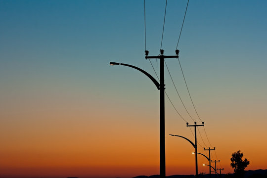 Electric power lines against a dawn sky