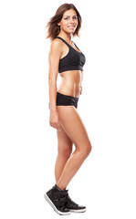 Young fit woman in sports outfit