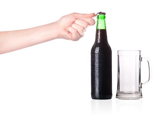 hand opening beer bottle with metal opener