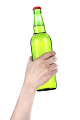 hand holding Bottle of beer with drops isolated