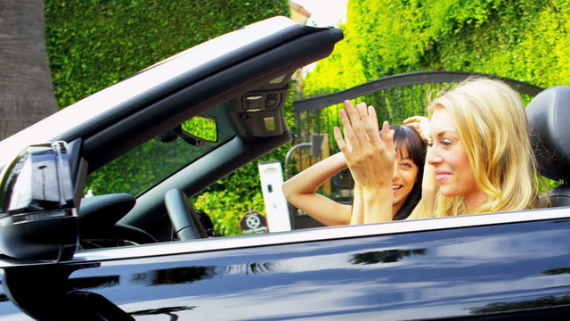 Young Girls Driving a Convertible