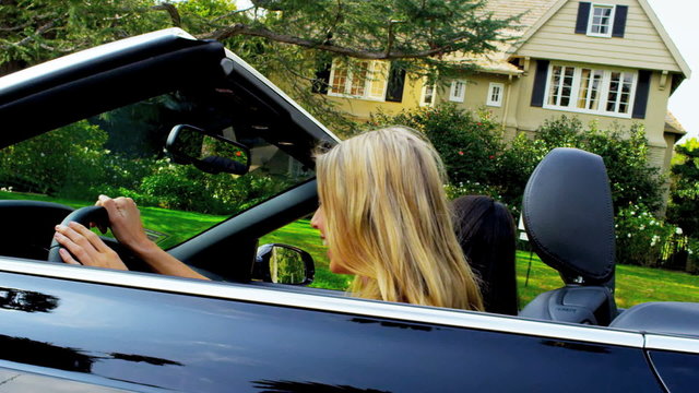 Caucasian Girls Driving Luxury Car