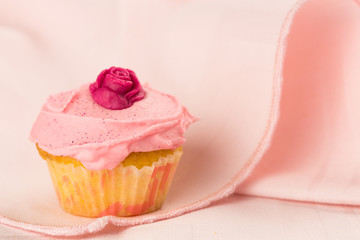 Pink cupcakes with red rose
