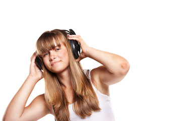Fototapeta premium Lovely girl listening a music in headphones