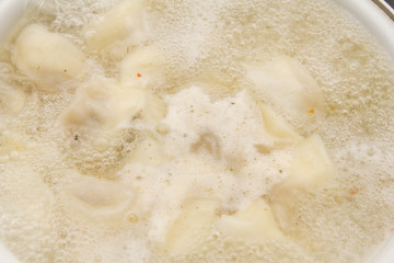dumplings are boiled in a pot