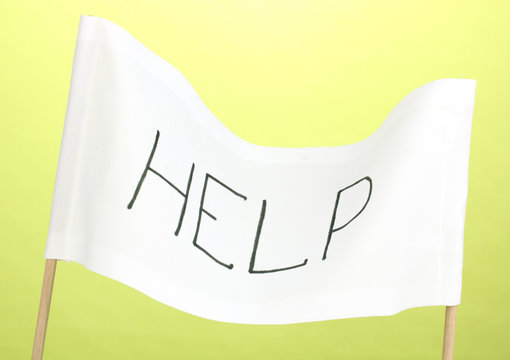 Fototapeta Help written on white cloth on green background