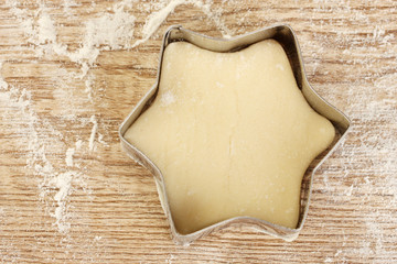 cutter for the dough to the unbaked biscuits