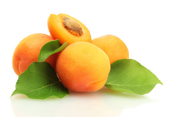 ripe sweet apricots with green leaves isolated on white