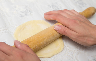 woman hands knead dough