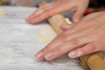 woman hands knead dough