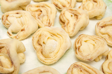 Half-finished product of a roll with cinnamon
