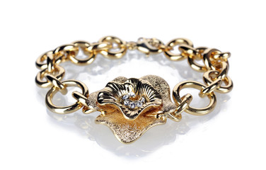 Beautiful golden bracelet with precious stones isolated on