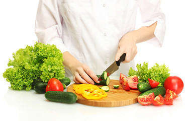 woman hands cutting vegetables on kitchen blackboard