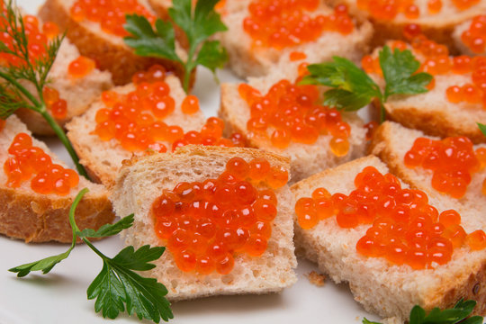 red caviar on bread with parsley