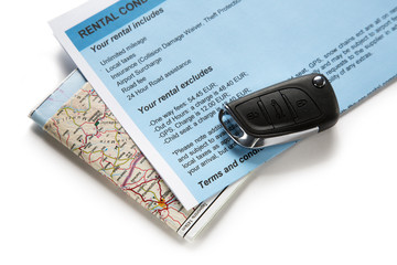 Road map and car key on white