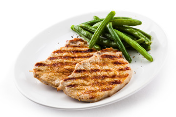 Grilled steaks, baked potatoes and vegetables