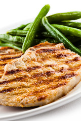 Grilled steaks, baked potatoes and vegetables