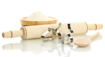 tins of cookies with a rolling pin isolated on white background