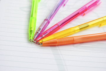 Color pens on the  writing-book