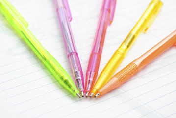 Color pens on the  writing-book