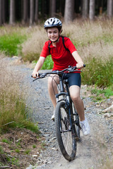 Obraz premium Girl biking