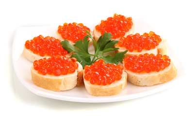 Red caviar on bread on white plate isolated on white