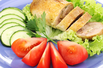 Tasty meat cutlet with garnish on plate close-up