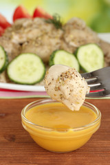 delicious dumpling dipped in sauce close-up